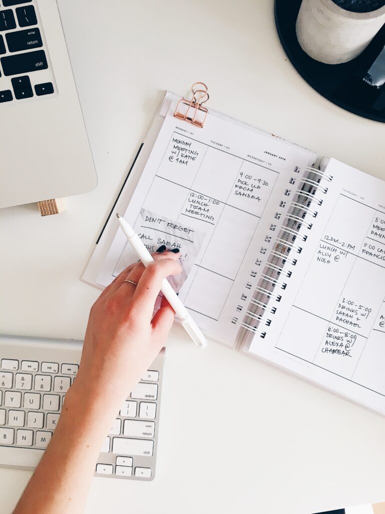 An entrepreneur with a planner, building her brand strategy | North Branch Copywriting Co. 