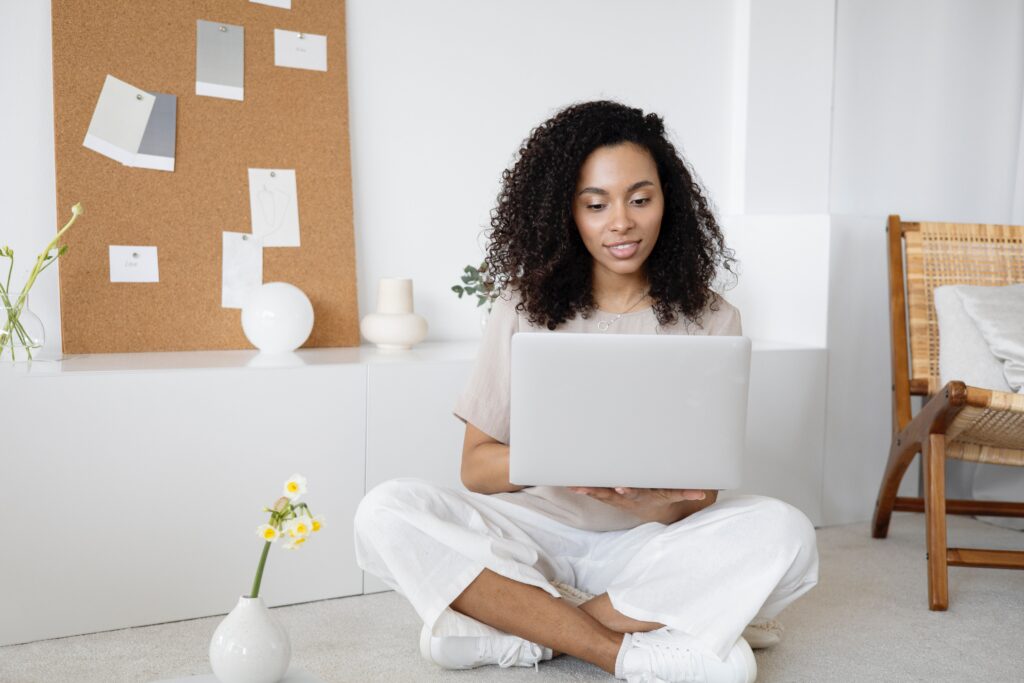 Business owner writing an email sequence while sitting on the floor | North Branch Copywriting Co. 