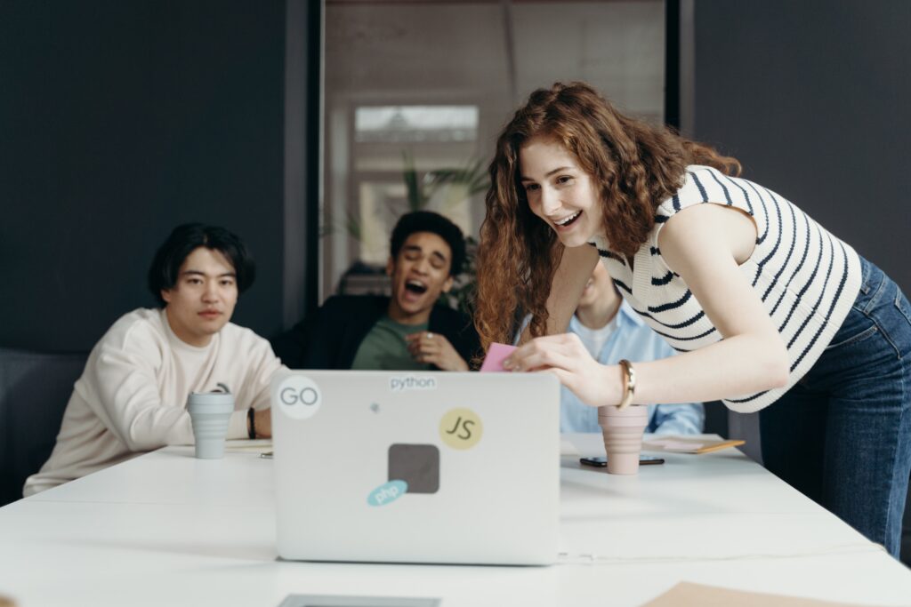 Group of people happily enjoying lead magnet ideas at work | North Branch Copywriting Co.