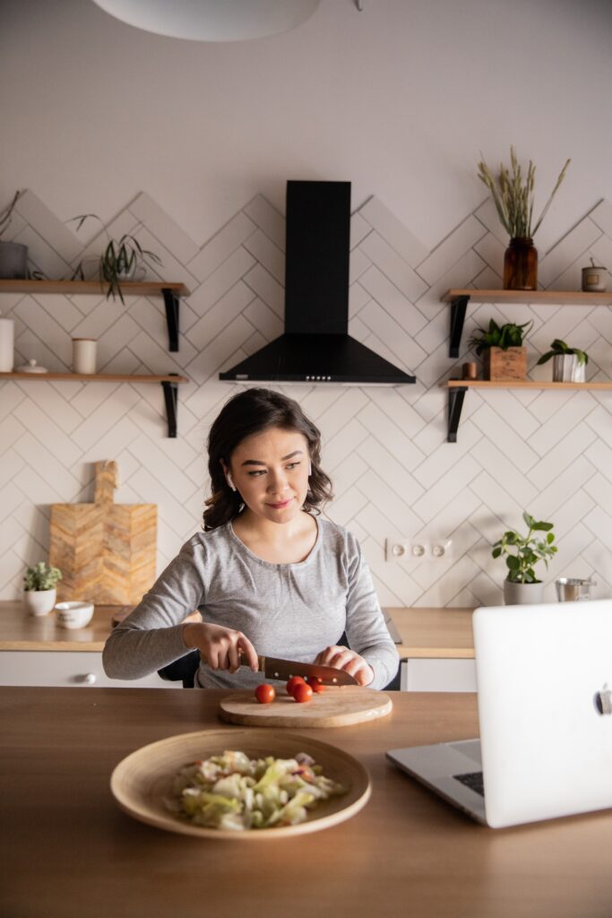 Woman cooking while engaging with a chef lead magnet example | North Branch Copywriting Co. 