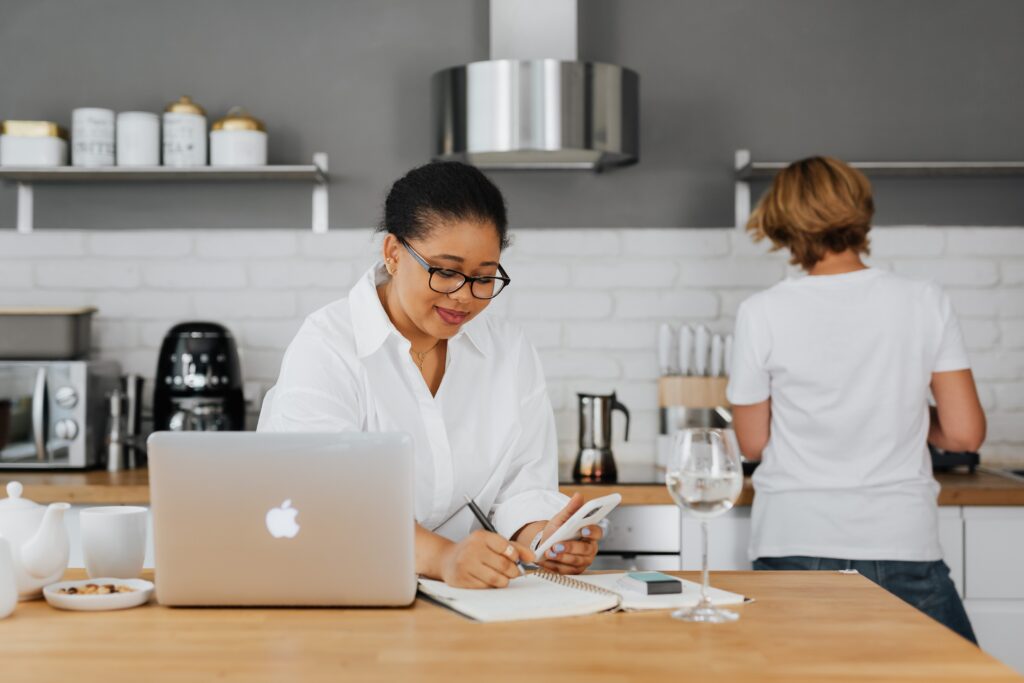 Woman performing informational search intent while Googling a recipe in the kitchen | North Branch Copywriting Co. 