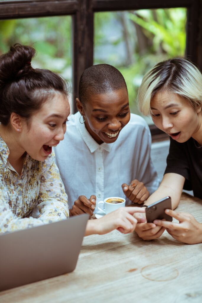 Women laughing at example of repurposing content for social media | North Branch Copywriting Co. 