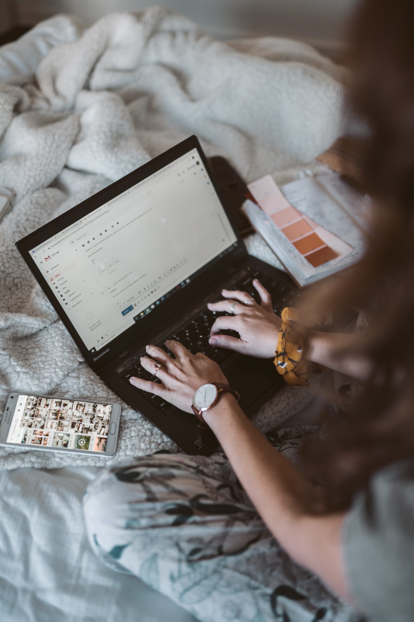 A close-up of a woman's hands as she works on copywriting emails | North Branch Copywriting Co.