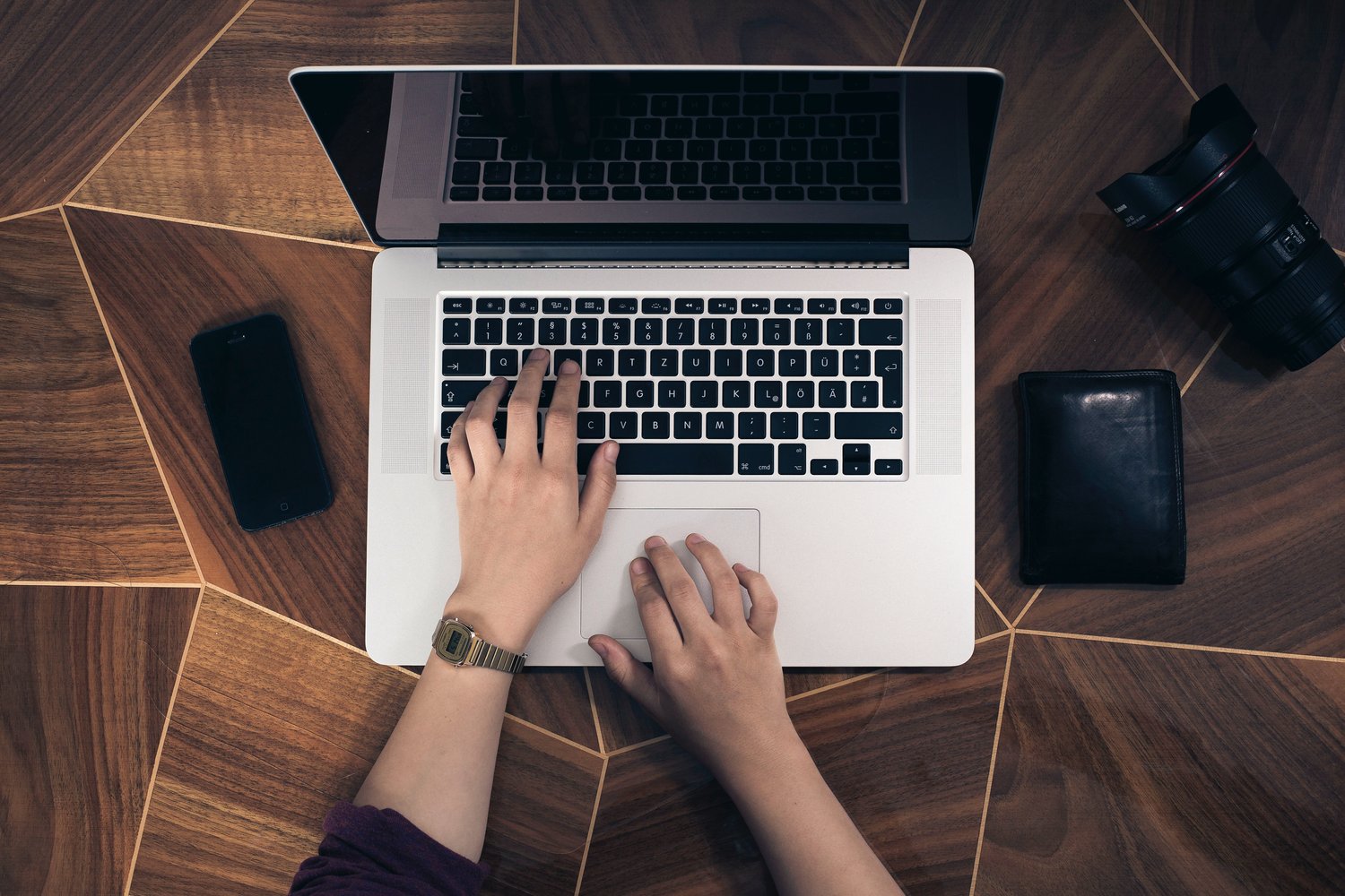 Close up of hands working to write copy for website | North Branch Copywriting Co.